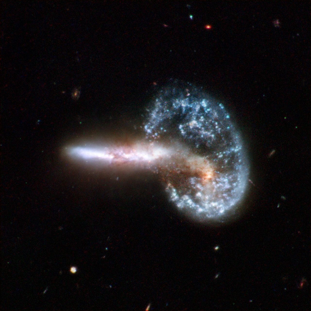 A photo showing two galaxies appearing to interact in space