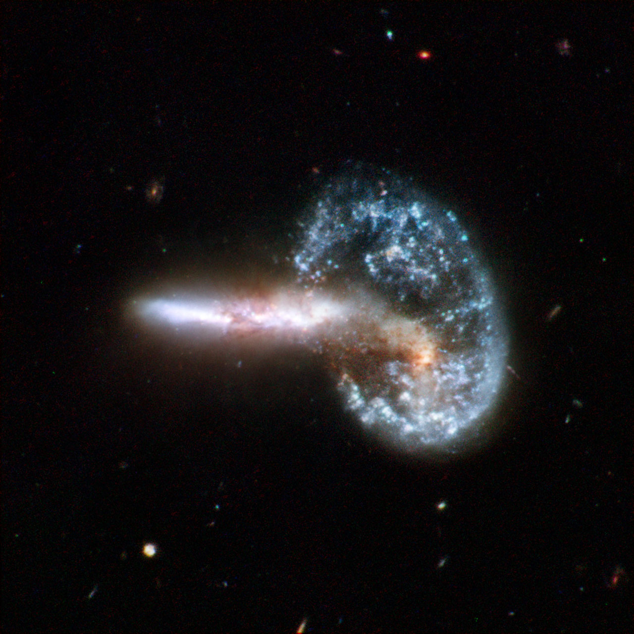 A photo showing two galaxies appearing to interact in space