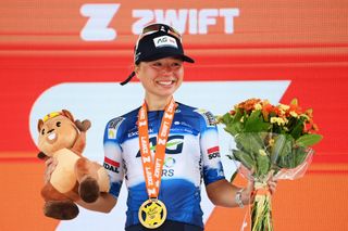 Justine Ghekiere on the podium after winning stage seven of the Tour de France Femmes 2024