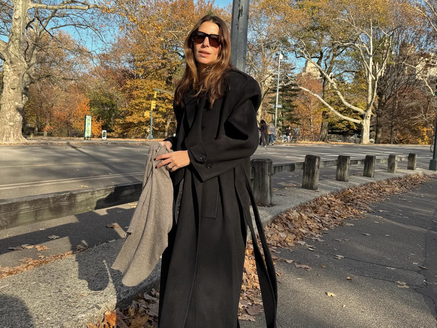 Fashion influencer @jen_wonders wearing a chic long wool winter coat.