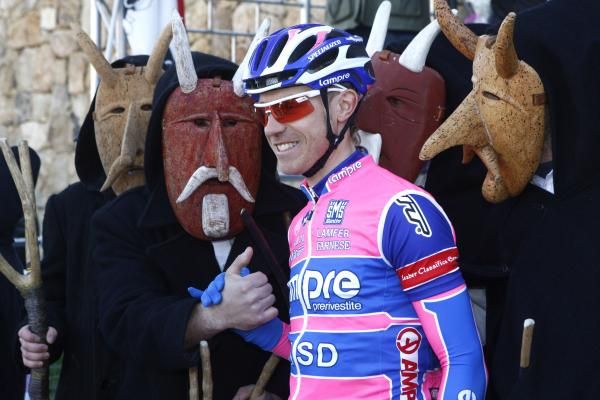 Damiano Cunego (Lampre-ISD) is greeted by some local colour in Sardinia.
