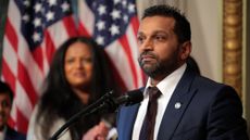 Kash Patel, in a blue suit, being sworn in as FBI Director