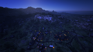 Valentine, a rugged Heartlands livestock town, at night. The rocky outcrop watching over the settlement is called Citadel Rock.