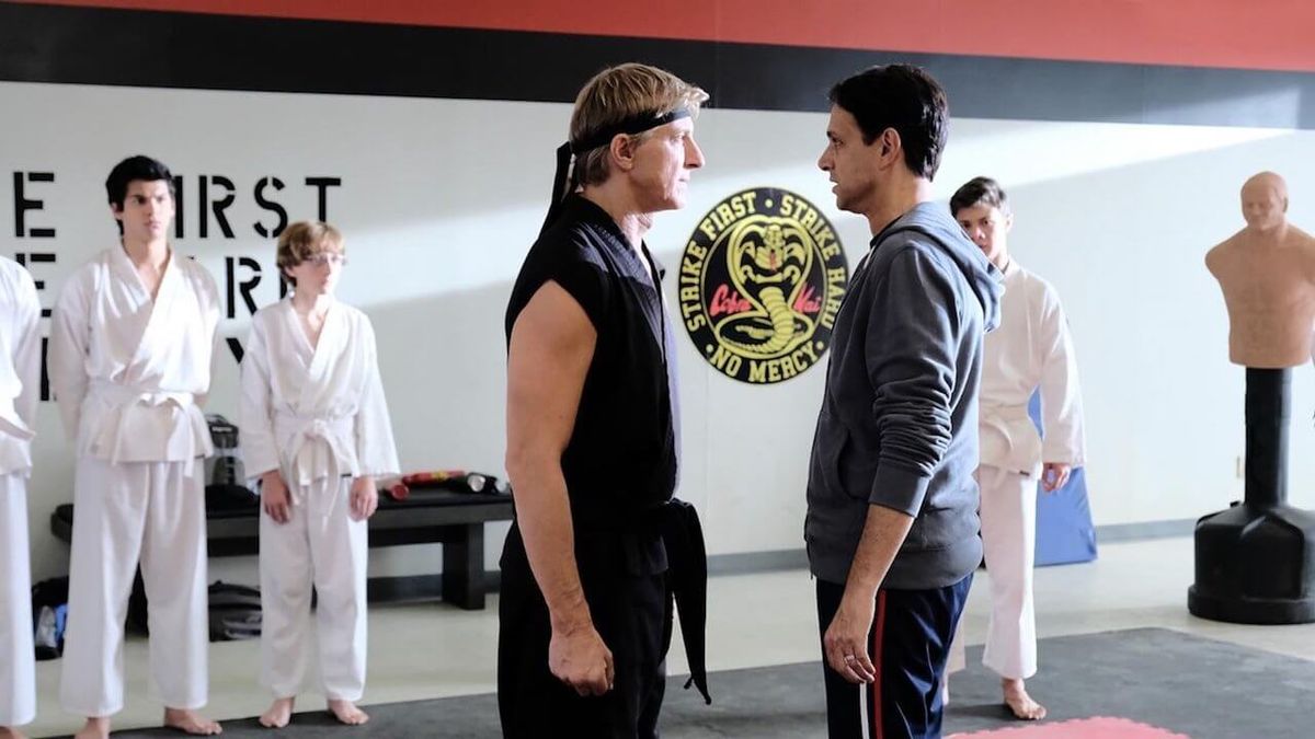 Daniel LaRusso (Ralph Macchio) and Johnny Lawrence (William Zabka) face off in the Cobra Kai dojo.