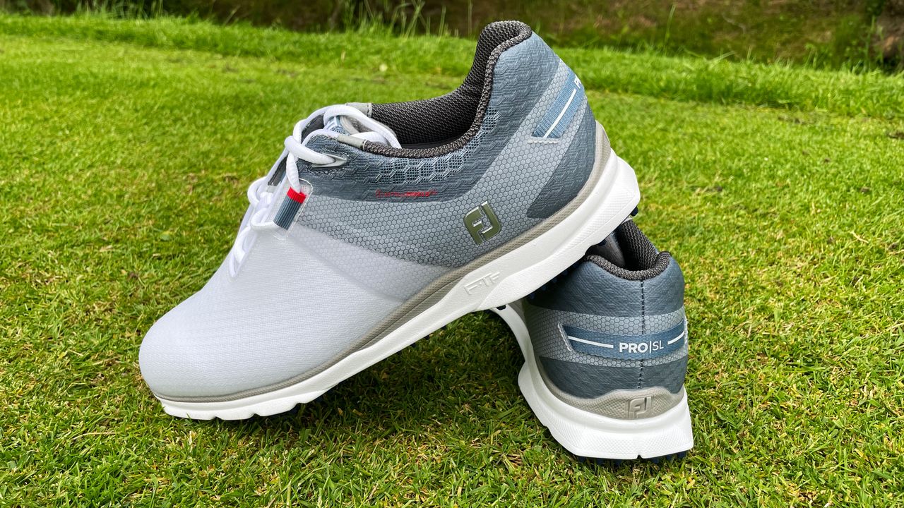 A pair of Pro SL Sport golf shoes on the tee box