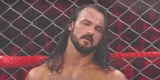 Drew McIntyre looking exhausted in a WWE ring.