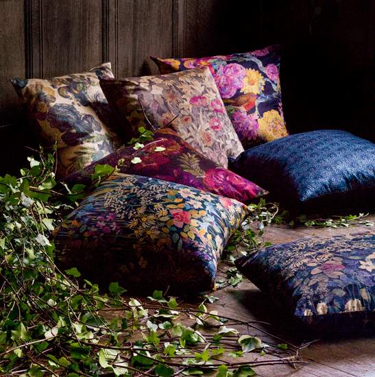 liberty floral garden fabric cushion on wooden floor