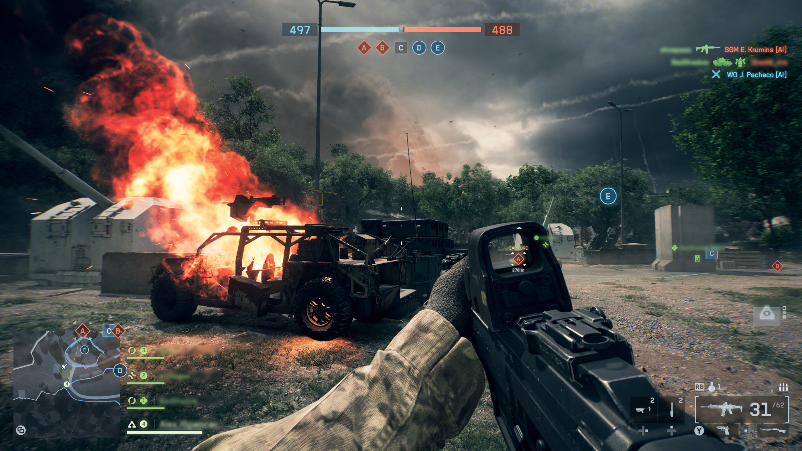 The player in Battlefield 6 in front of a flaming vehicle, rifle raised - from EDGE 415