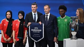 Gareth Bale, heading the delegation for UK and Ireland to host Euro 2028, picture alongside UEFA president Aleksander Ceferin in October 2023.