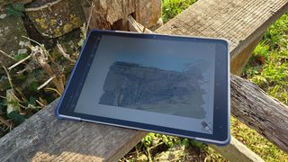 XPPen Magic Drawing Pad review; a drawing tablet on a wooden fence