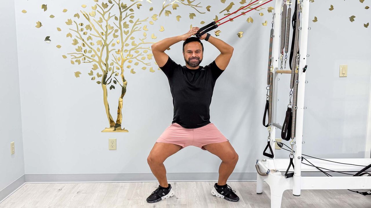 Nico Gonzalez performing the standing side bends in sumo squat exercise