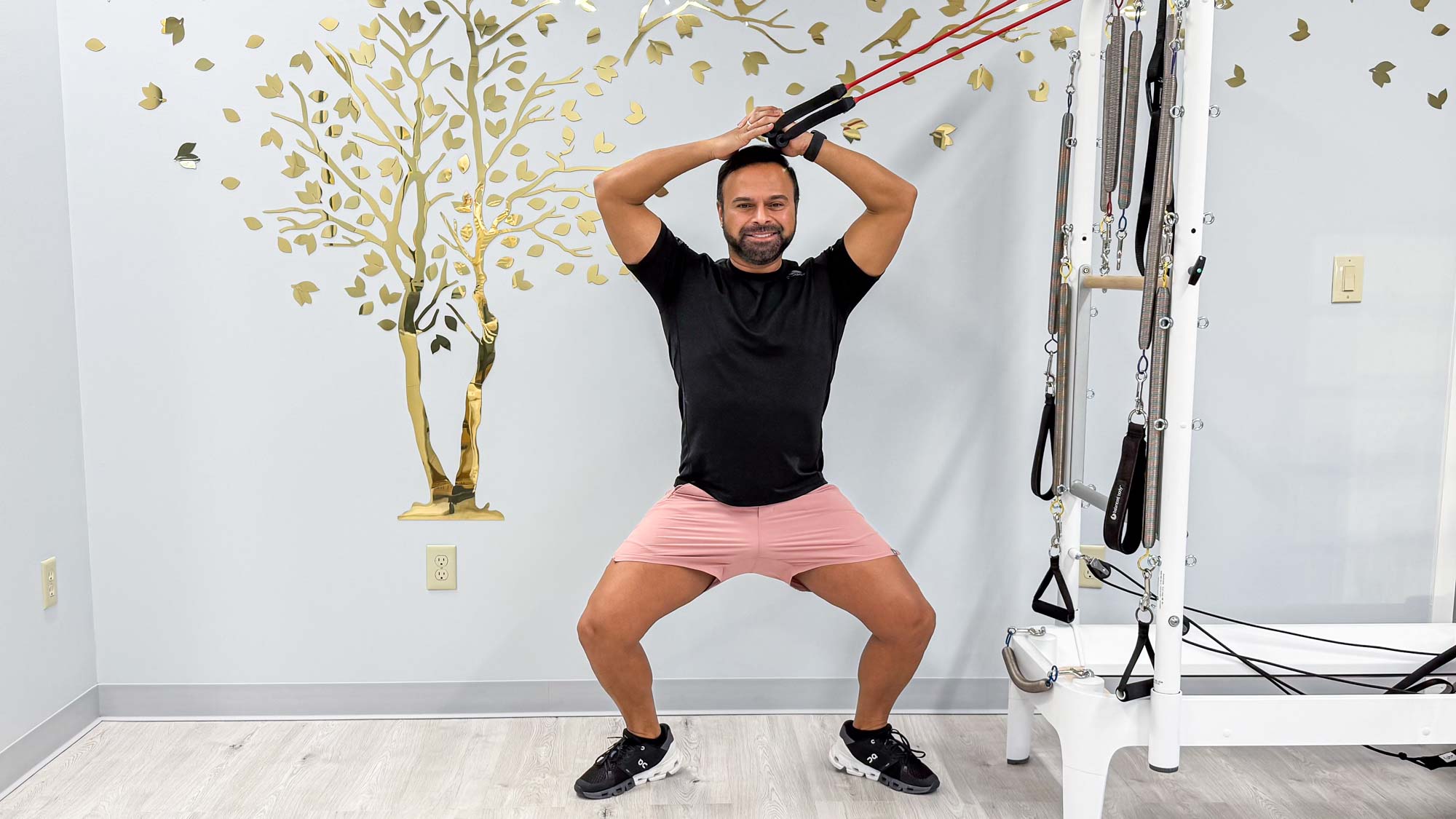 Nico Gonzalez performing the standing side bends in sumo squat exercise