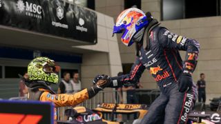 A driver helps another out of a car.