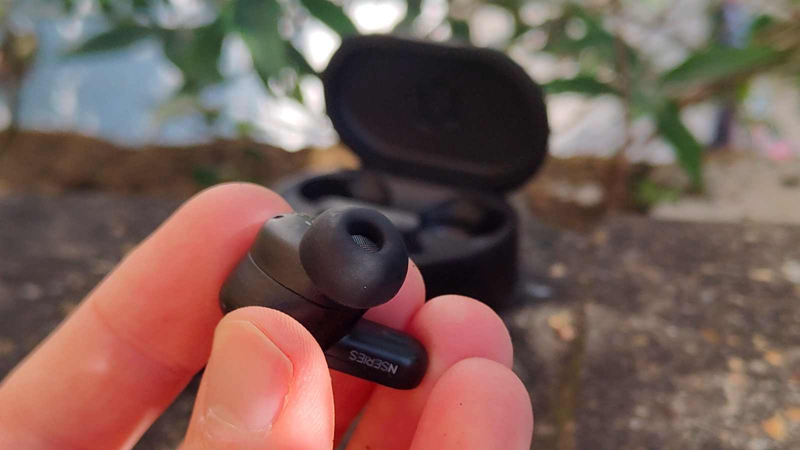The AKG N5 in a man's hand.