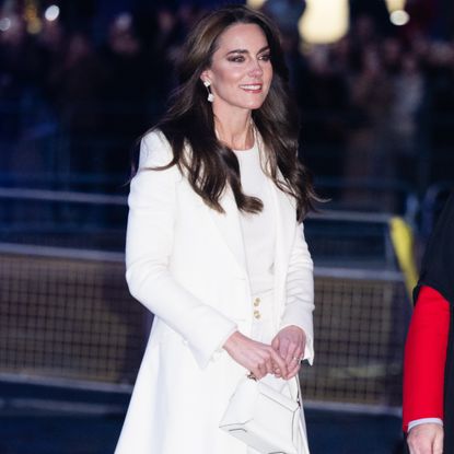 Kate Middleton walking to an event carrying a strathberry bag included in the label's black friday sale