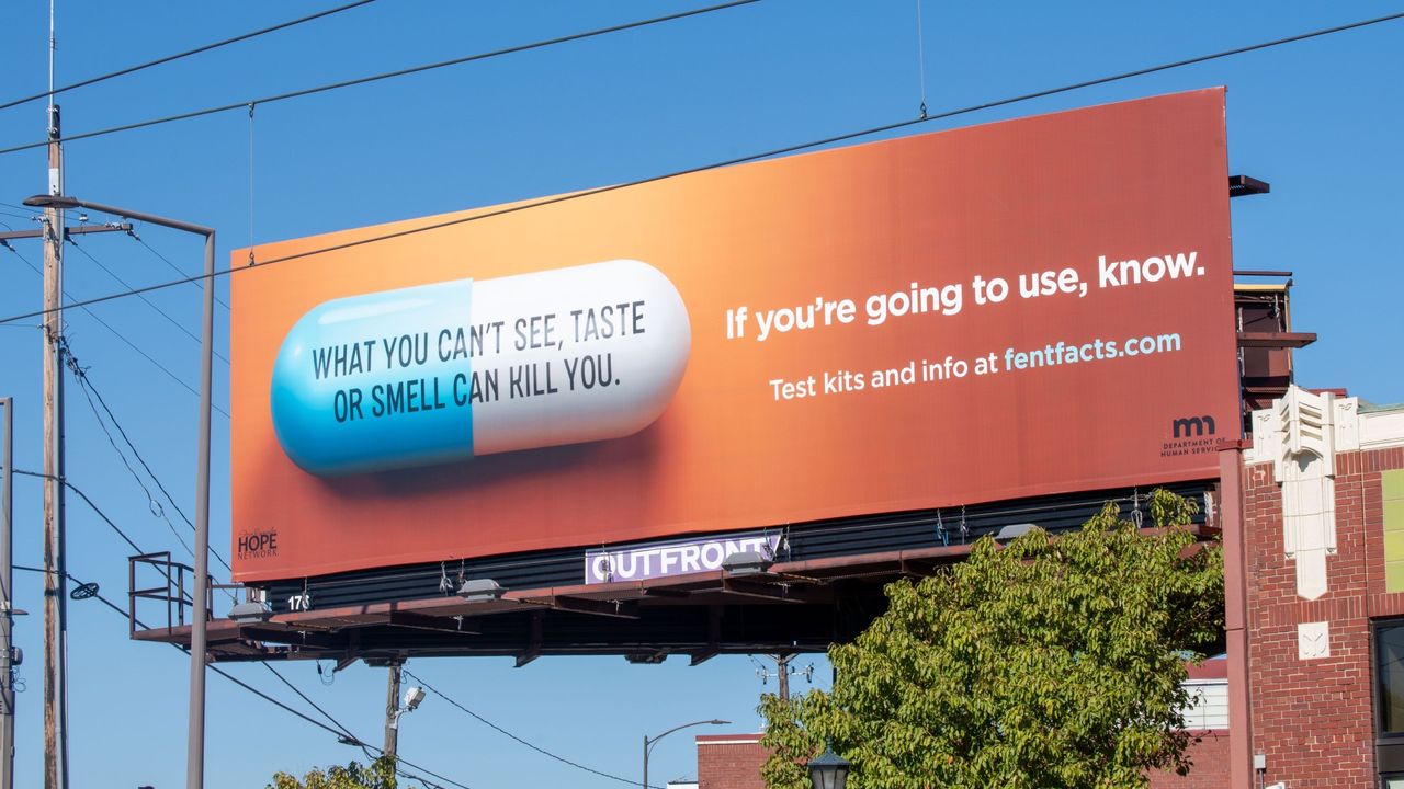 A billboard advertising test kits and information for drug users.