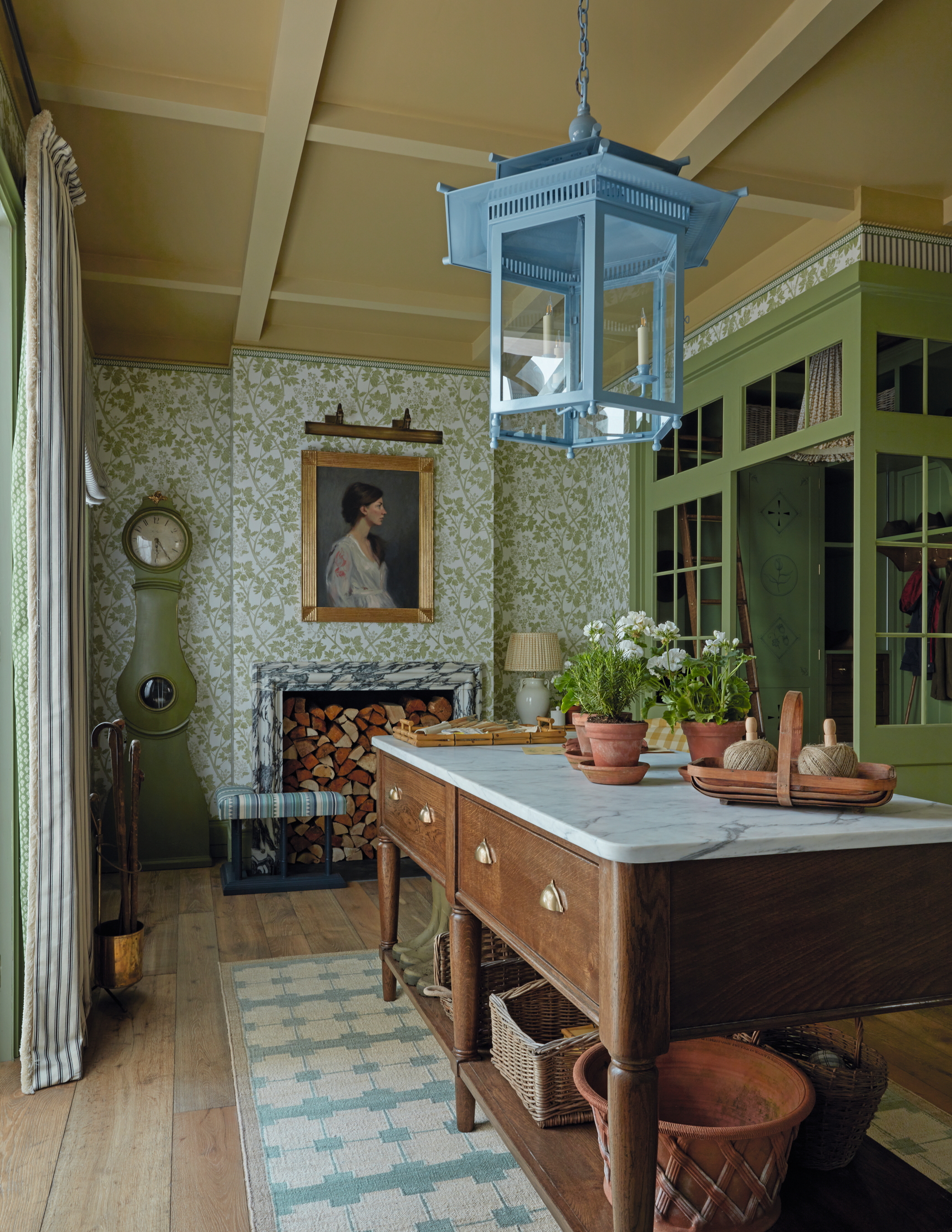 The modern boot room by Sims Hilditch, with a table in the centre