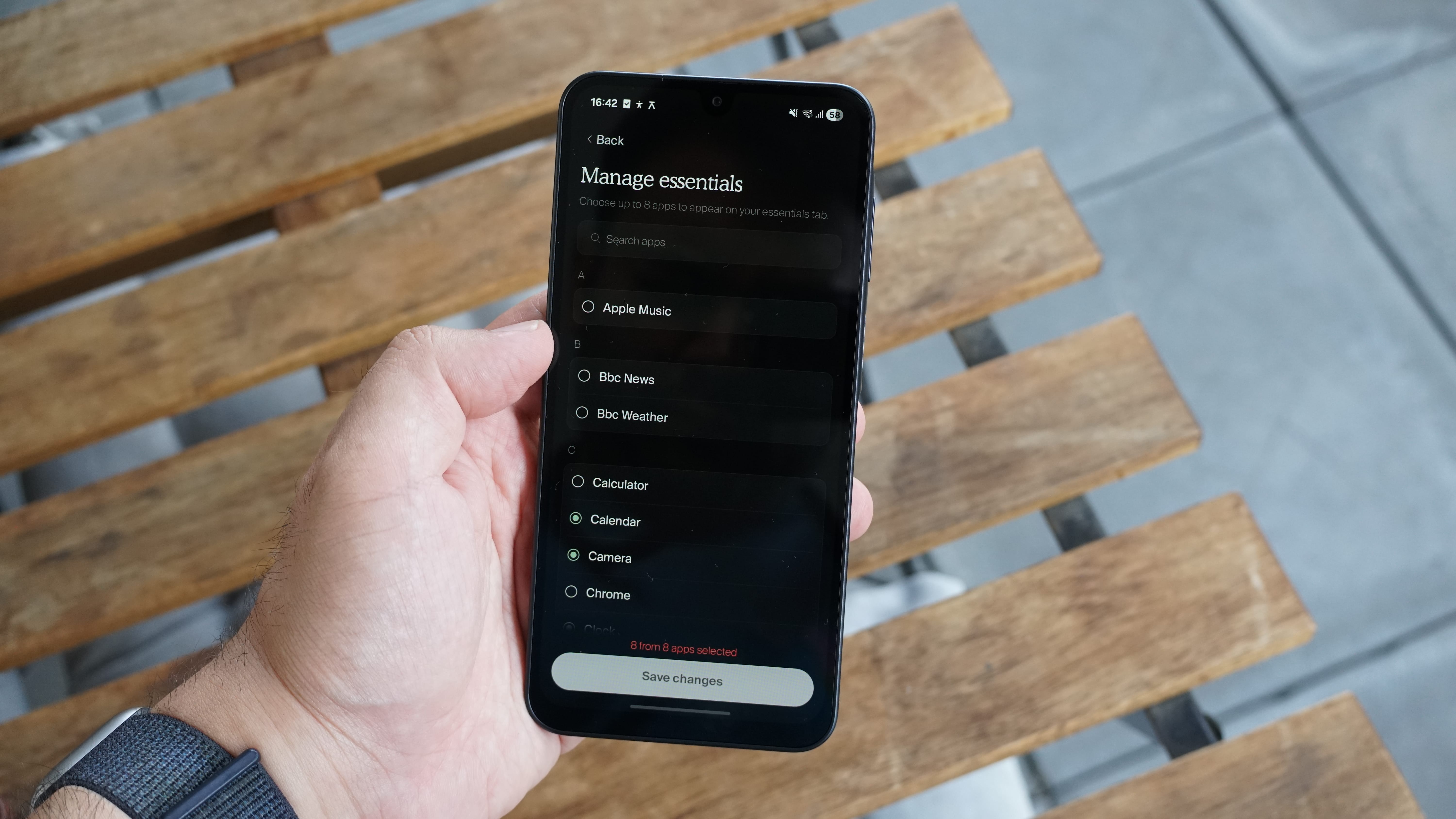 The Balance Phone being held in the hand