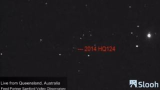 The near-Earth asteroid 2014 HQ124 is seen via telescope from Australia in this June 5, 2014 photo captured by the online Slooh community observatory. The asteroid will fly by Earth, outside the orbit of the moon, on June 8.