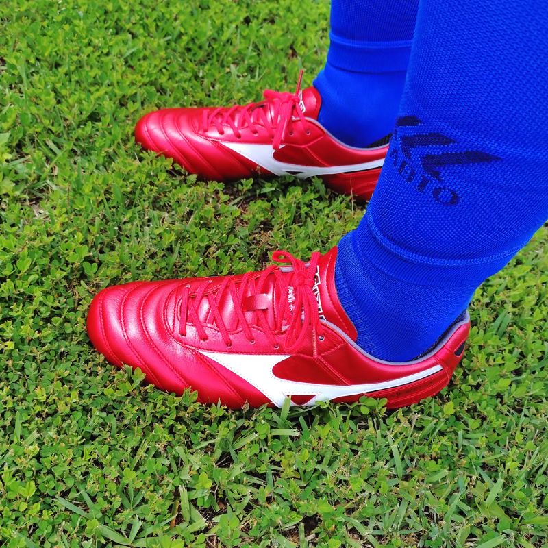 Mizuno Morelia II boots in red on green grass