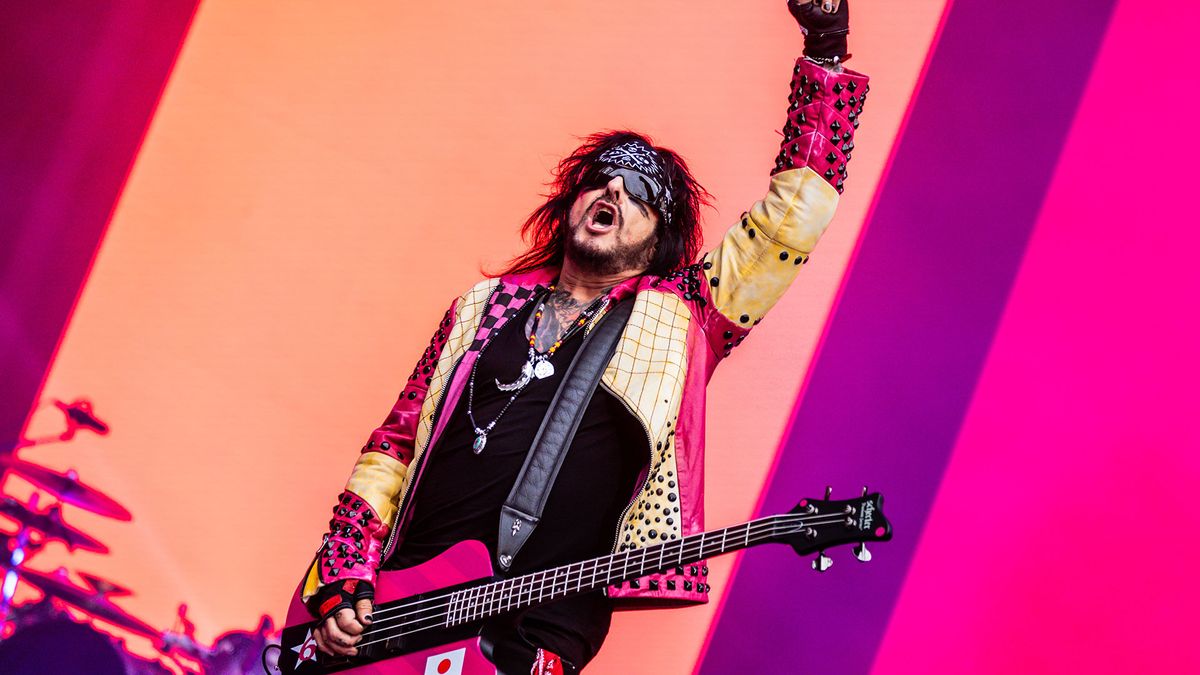 Nikki Sixx playing bass onstage