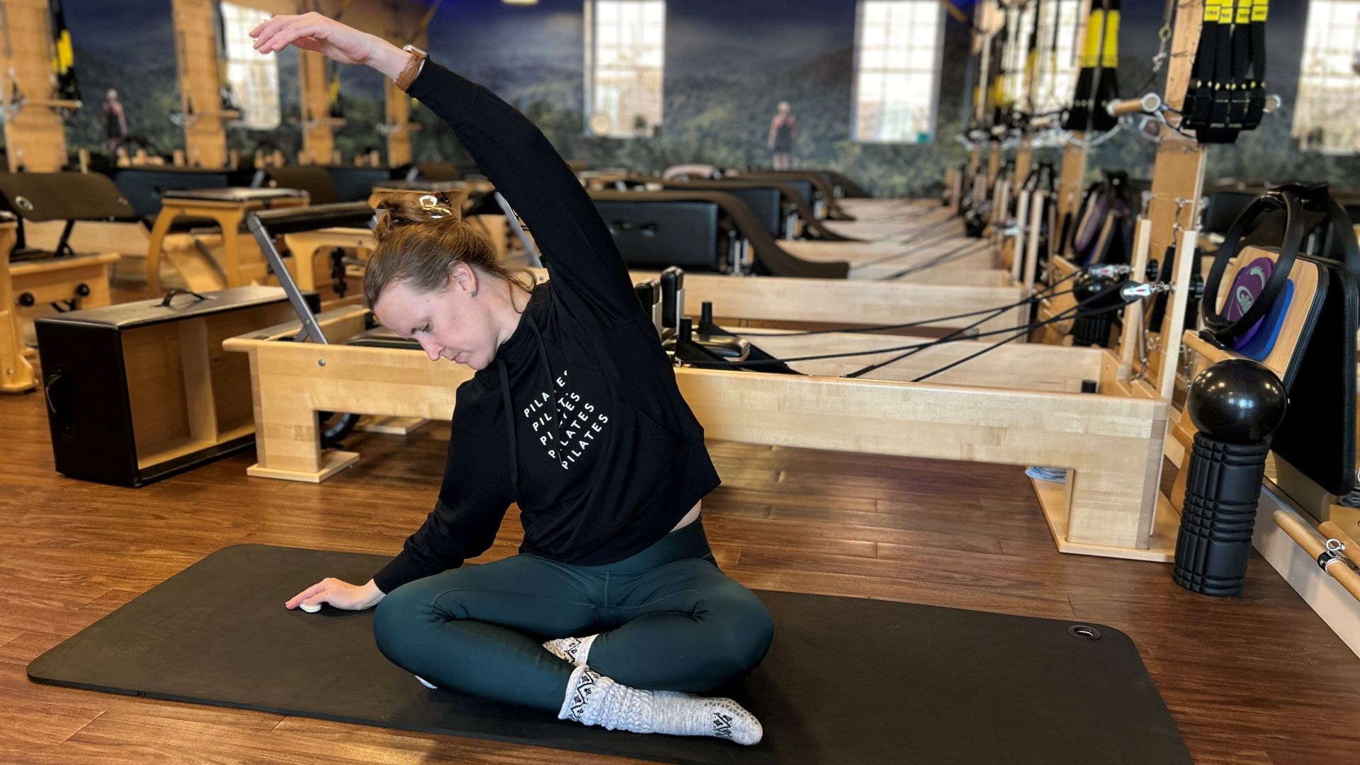 Certified Pilates Teacher Juanita Franke demonstrates mermaid