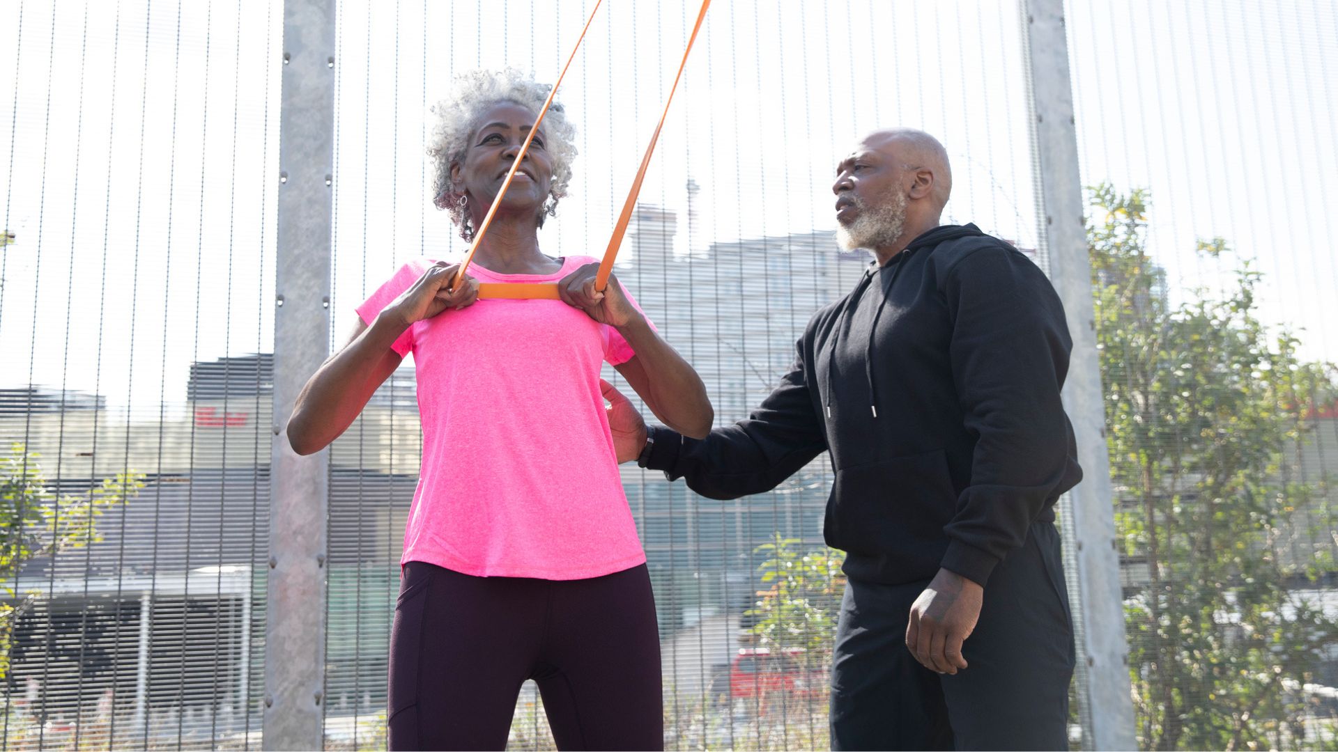 senior couple train together outdoors