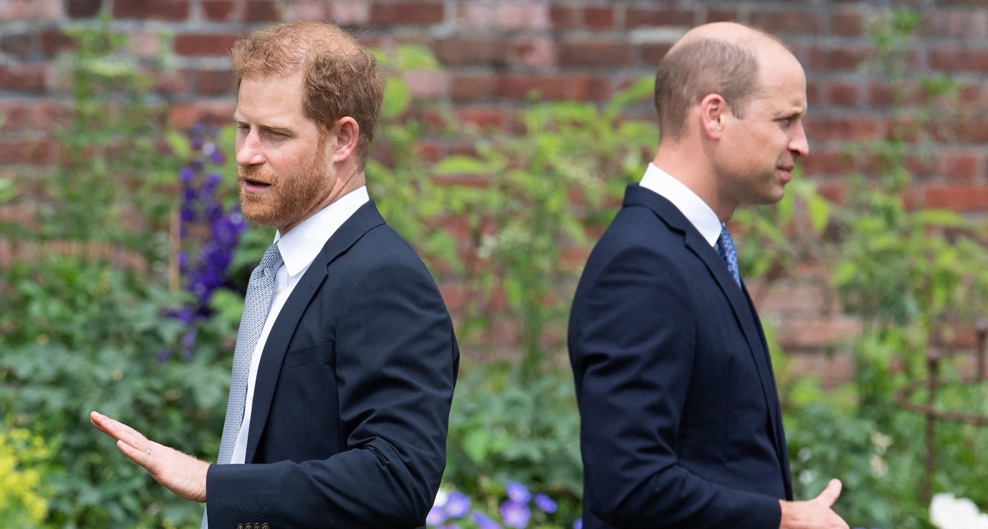 Prince William and Prince Harry with their backs to each other