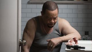 Ice-T as Fin treating a gun wound in Law & Order: SVU season 25 episode 13