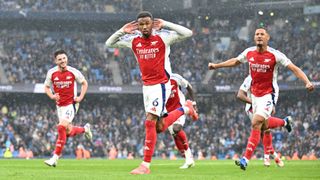 Gabriel of Arsenal celebrates scoring his team's second goal during the Premier League match between Manchester City FC and Arsenal FC at Etihad Stadium on September 22, 2024 in Manchester, England.