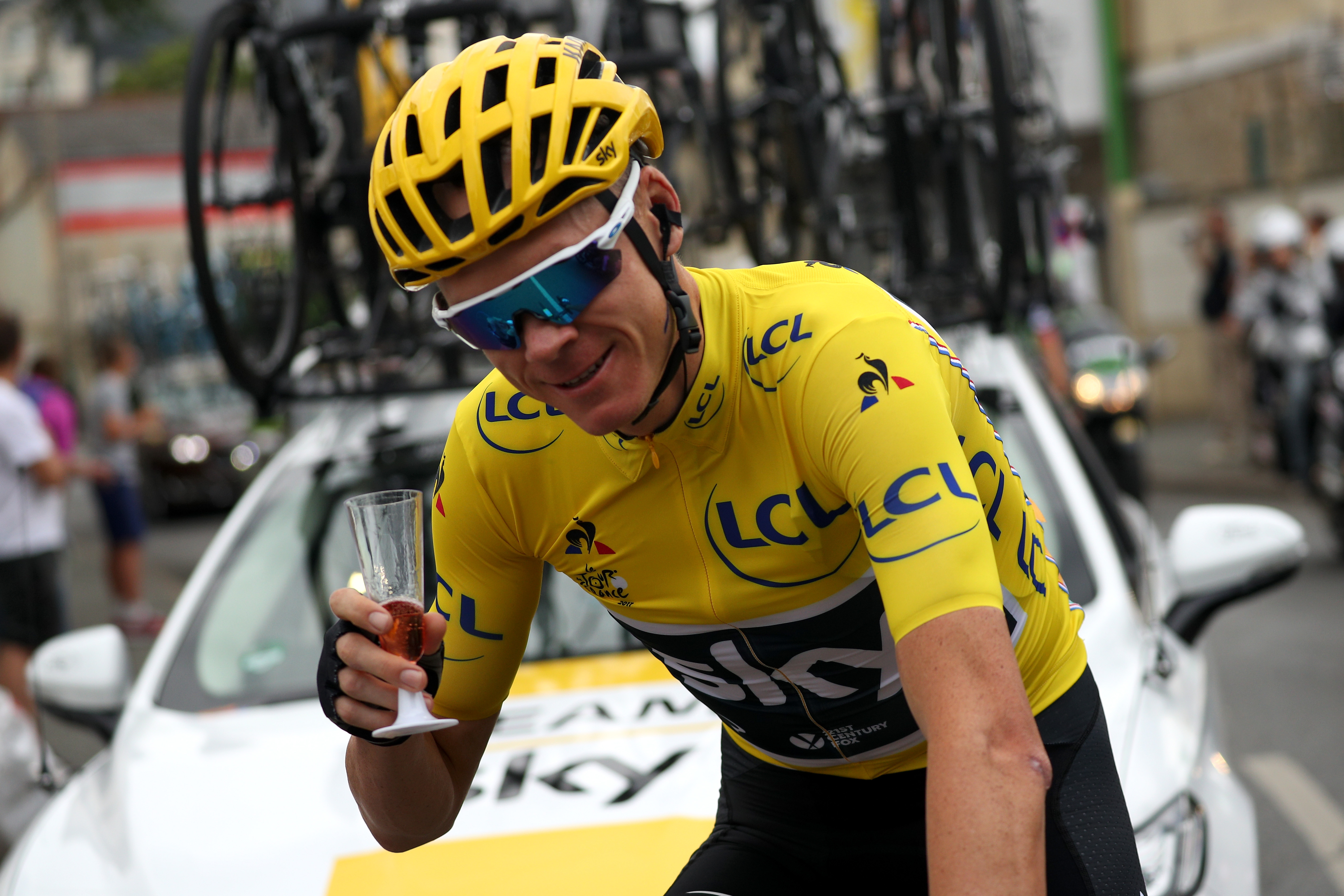 Chris Froome at the 2017 Tour de France with a glass of champagne