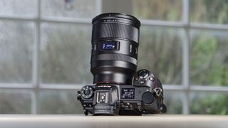 Viltrox AF 35mm F1.2 LAB Z lens for Nikon, attached to a Nikon Z6 II, on a wooden table