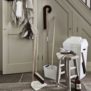 mop basket bin and wooden table