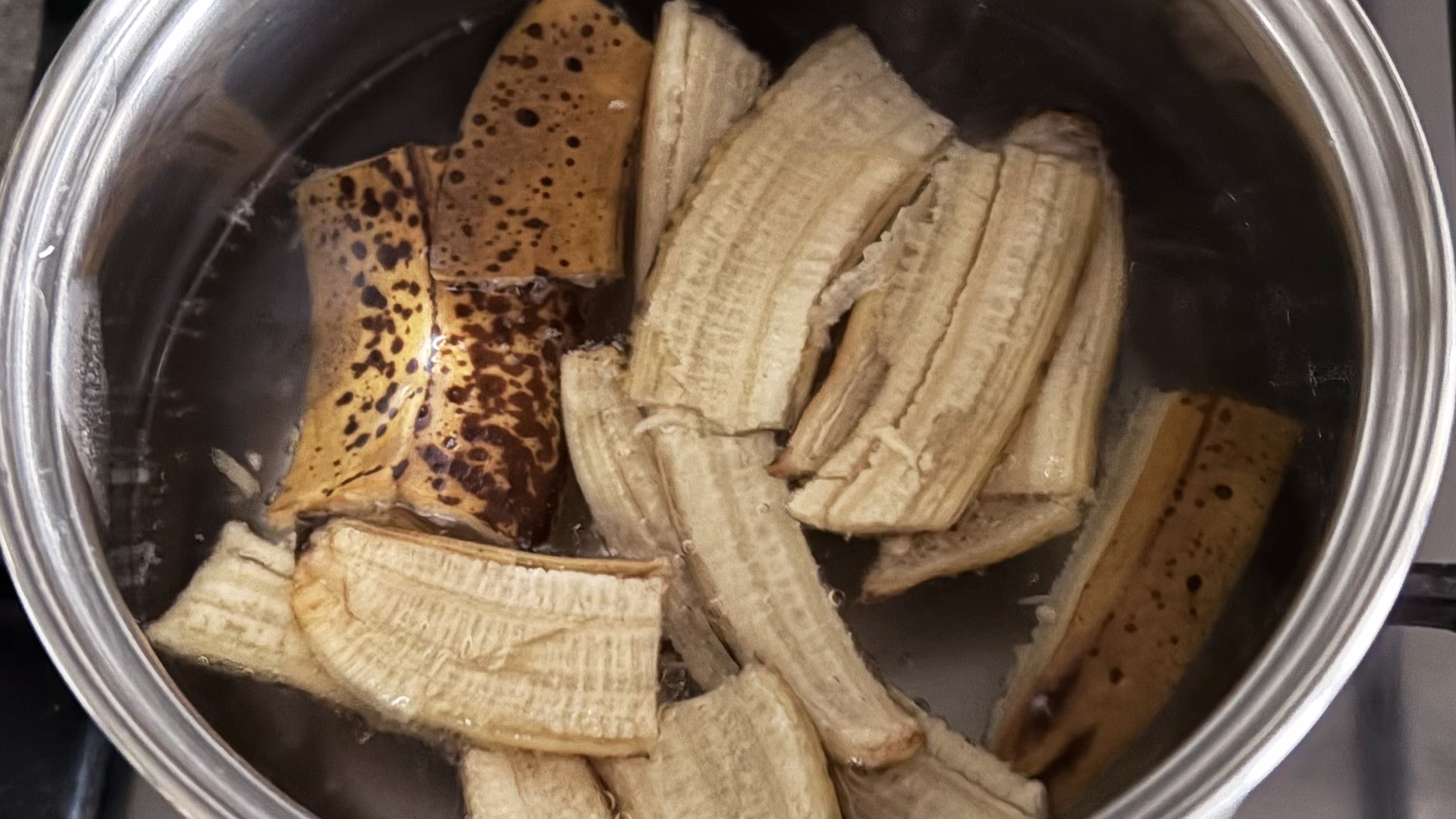 A close up of banana skins being boiled in water