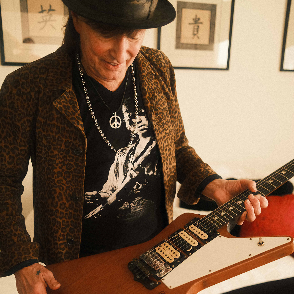 Richie Sambora inspecting his long-lost guitar