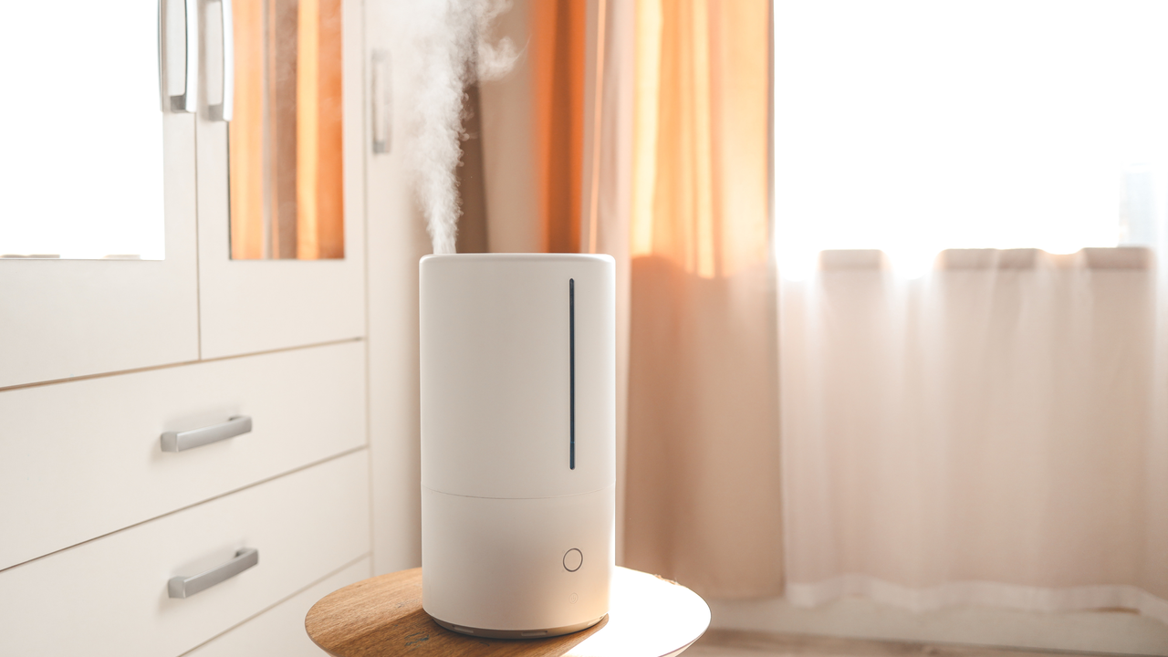 Large humidifier on a stool in bedroom