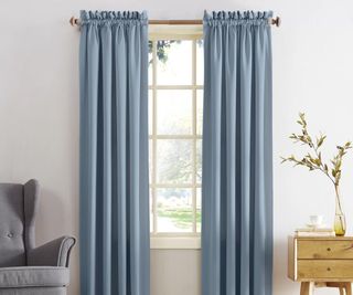 Blue curtains against a white wall.