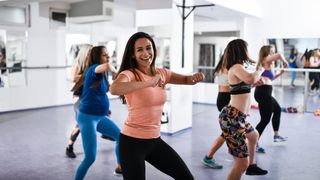 a group of people doing zumba