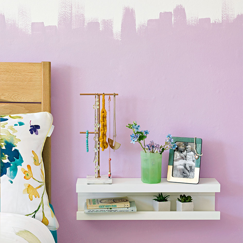 bedroom with purple wall and walled shelf