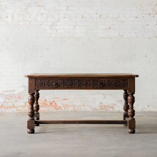 A vintage, wooden, engraved desk from Magnolia