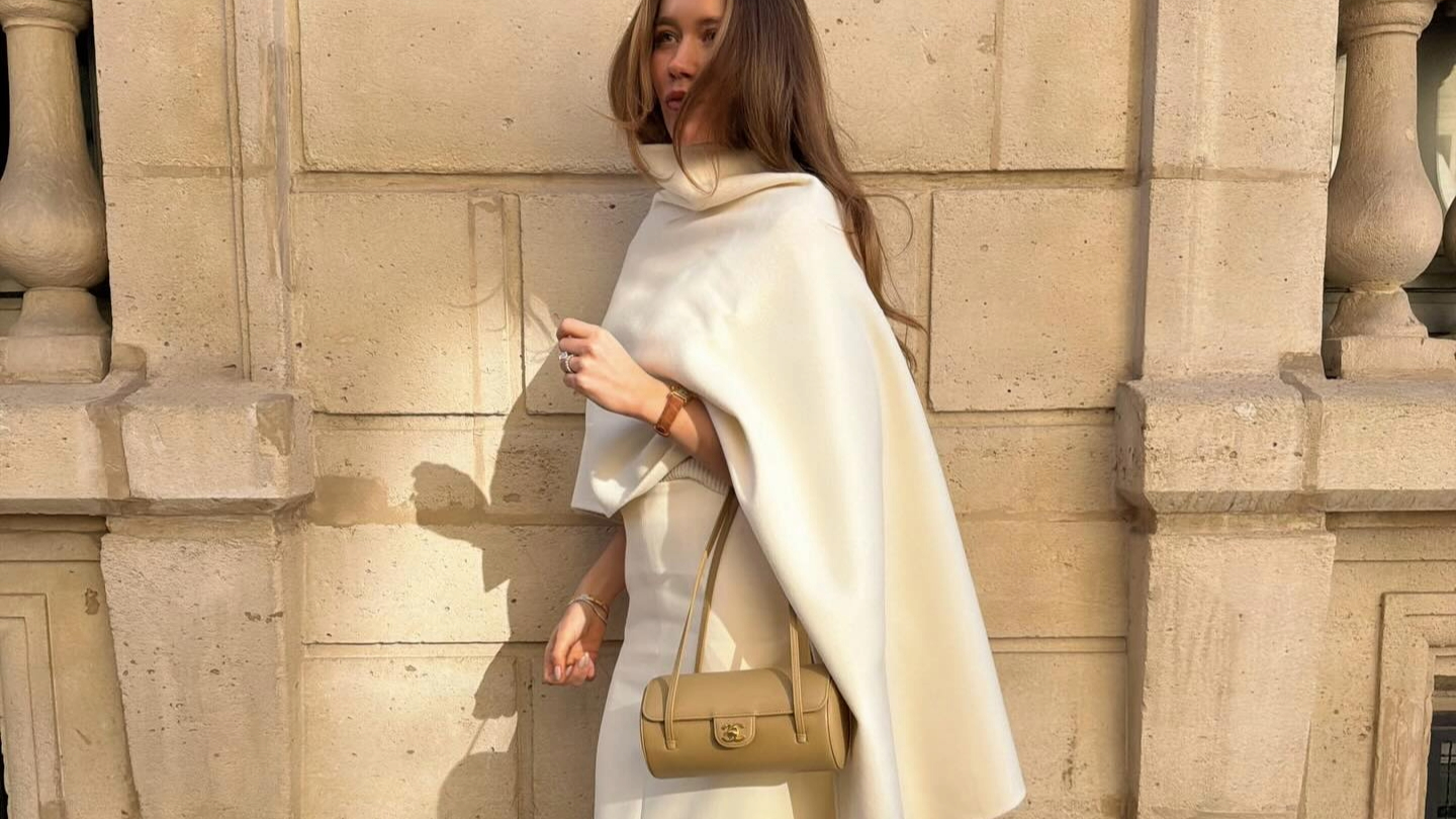 Lovisa Barkman in a white cape top and Chanel bag
