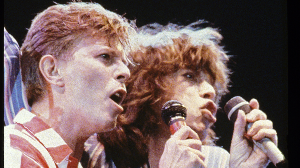 LONDON - JUNE 20: David Bowie and Mick Jagger performing on stage at The Prince's Trust 10th Birthday Party at Wembley Arena, London, United Kingdom on 20th June 1986. (Photo by Brian Cooke/Redferns)