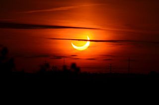 16-year-old skywatcher Jason Materazo capture this view of the partial solar eclipse of June 10, 2021 visible from Ronkonkoma, New York at sunrise just after 5:26 a.m. EDT.