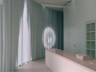 Green curtains and pink interiors at Art Pavilion M
