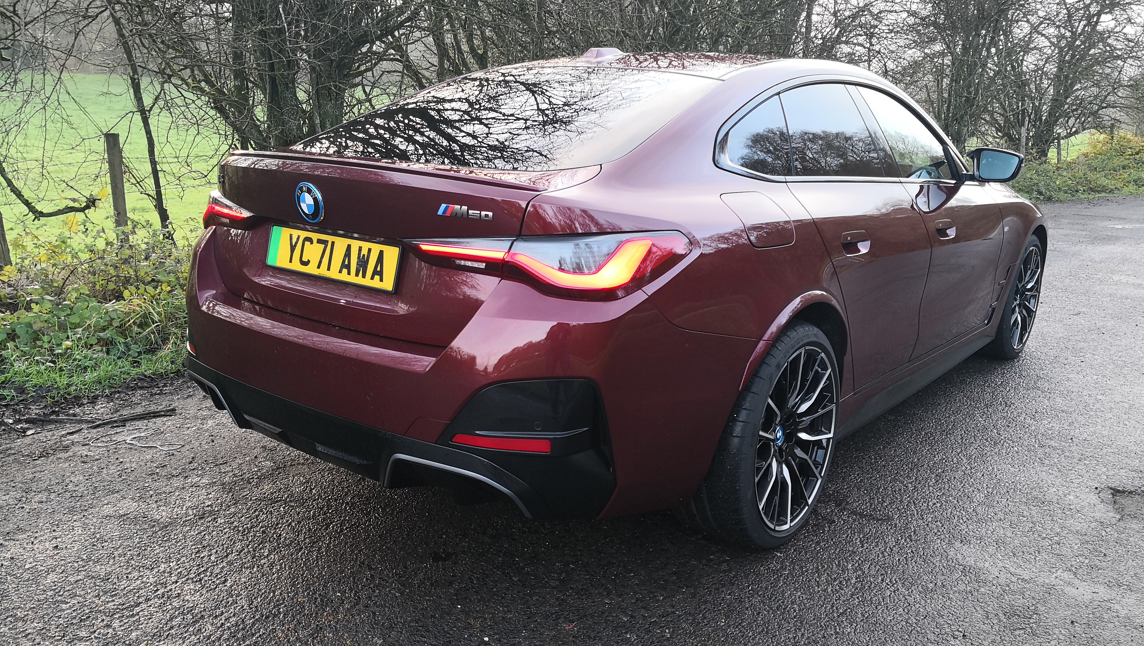 bmw i4 in red from behind