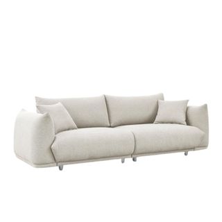 A beige cloud couch with two pillows