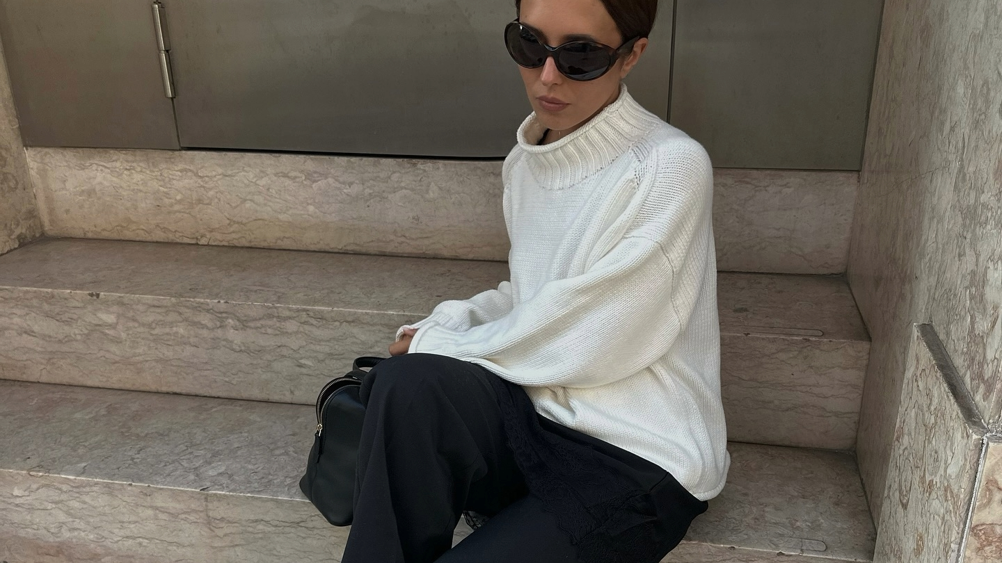 Debora Rosa in a white J.Crew rollneck sweater