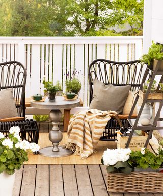 outdoor seating on porch with potted plants