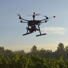 Drone flying over field