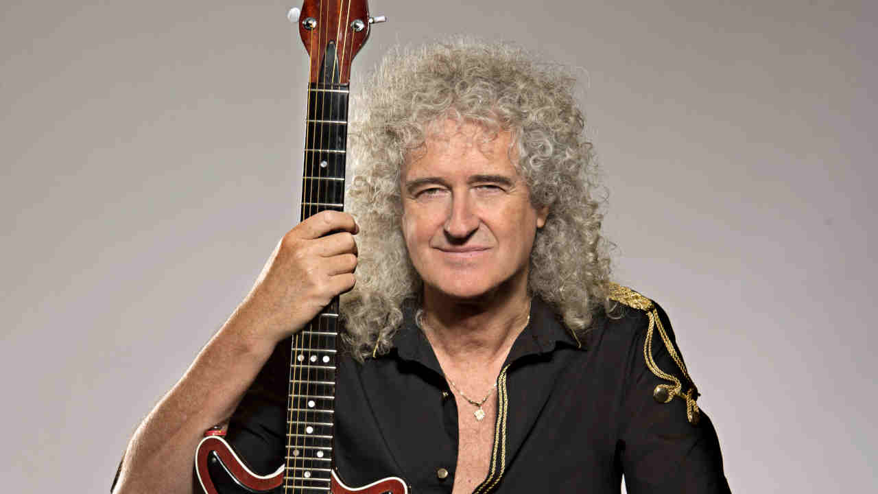 Queen’s Brian May posing for a photograph in 2014